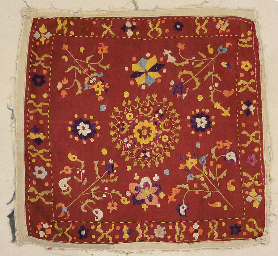 Antique Uzbek Turkestan Wool and Silk Suzani. A piece of wool and silk woven art sold by Santa Barbara Design Center Rugs and More in Santa Barbara CA.