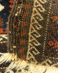An antique and original burial Baluch dated rug. Dated on all four corners. Used as a casket covering. Sold by Santa Barbara Design Center.