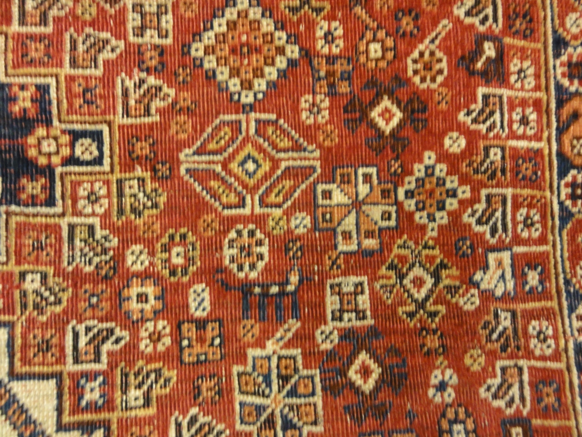 Antique Persian Qashqai Rug. A piece of genuine woven carpet art sold by the Santa Barbara Design Center, Rugs and More in Santa Barbara, California.