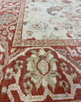 Close-up of Original Ziegler & Co. Sultanabad rug, showcasing intricate floral patterns in red, beige, and soft blue tones.