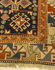 Antique Shirvan Rug Featuring Peacock and Two Men. A genuine authentic antique piece of woven carpet art sold by Santa Barbara Design Center, Rugs and More.