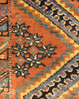 An antique Persian Afshar rug featuring a diamond pattern. A piece of genuine original woven carpet art sold by the Santa Barbara Design Center.