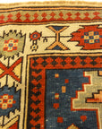 Rare Antique Leshgi Star Rug featuring Men Standing on Horses. A piece of genuine antique authentic woven carpet art sold by Santa Barbara Design Center.