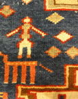 Rare Antique Leshgi Star Rug featuring Men Standing on Horses. A piece of genuine antique authentic woven carpet art sold by Santa Barbara Design Center.