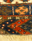 Kurdish Bagface Jaf Kurd. A genuine, antique piece of woven carpet art sold by Rugs & More in the Santa Barbara Design Center.