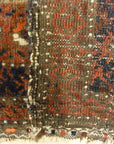 An antique, original Persian Baluch rug. A piece of genuine and authentic carpet art sold at Santa Barbara Design Center. Rugs and More.