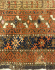 An antique, original Persian Baluch rug. A piece of genuine and authentic carpet art sold at Santa Barbara Design Center. Rugs and More.
