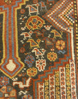 Antique Persian Khamseh Chicken Rug. A piece of genuine woven carpet art sold by Santa Barbara Design Center Rugs and More.