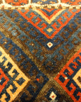 Kurdish Bagface Jaf Kurd. A genuine, antique piece of woven carpet art sold by Rugs & More in the Santa Barbara Design Center.