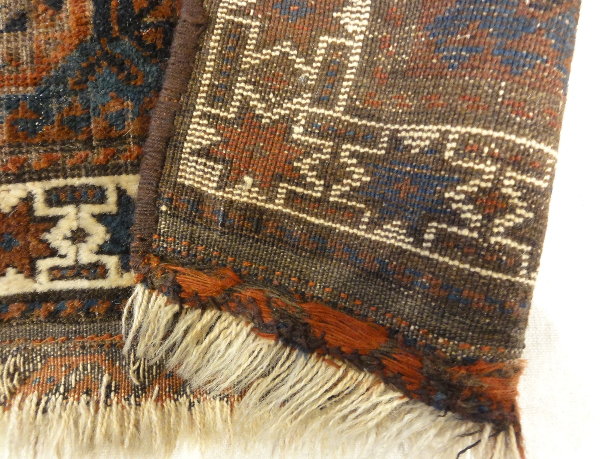 Antique Baluch Bagface. Rugs & More in the Santa Barbara Design Center. This Antique Baluch Bagface is a beauty, unique, and a treasure to be found.