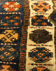 Kurdish Bagface Jaf Kurd. A genuine, antique piece of woven carpet art sold by Rugs & More in the Santa Barbara Design Center.