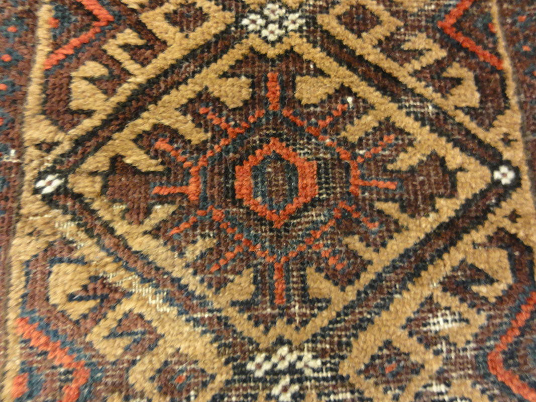 Antique Camel Hair Afghanistan Beluch. A piece of antique woven carpet art sold by Santa Barbara Design Center Rugs and More in Santa Barbara, California.