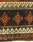 An antique and original burial Baluch dated rug. Dated on all four corners. Used as a casket covering. Sold by Santa Barbara Design Center.