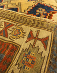 Rare Antique Leshgi Star Rug featuring Men Standing on Horses. A piece of genuine antique authentic woven carpet art sold by Santa Barbara Design Center.