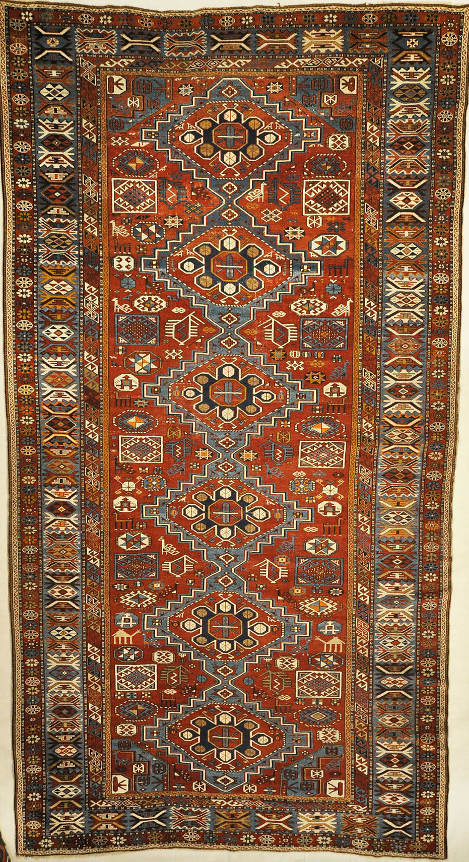 Fine Antique Shiwan long rug hand made of natural wool and organic dyes. Beautiful antique piece with animals and unique vibrant colors.