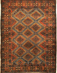 An antique Persian Afshar rug featuring a diamond pattern. A piece of genuine original woven carpet art sold by the Santa Barbara Design Center.
