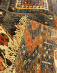Kurdish Bagface Jaf Kurd. A genuine, antique piece of woven carpet art sold by Rugs & More in the Santa Barbara Design Center.