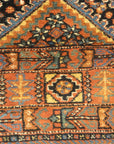 An antique Persian Afshar rug featuring a diamond pattern. A piece of genuine original woven carpet art sold by the Santa Barbara Design Center.