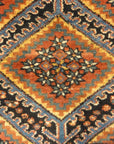 An antique Persian Afshar rug featuring a diamond pattern. A piece of genuine original woven carpet art sold by the Santa Barbara Design Center.