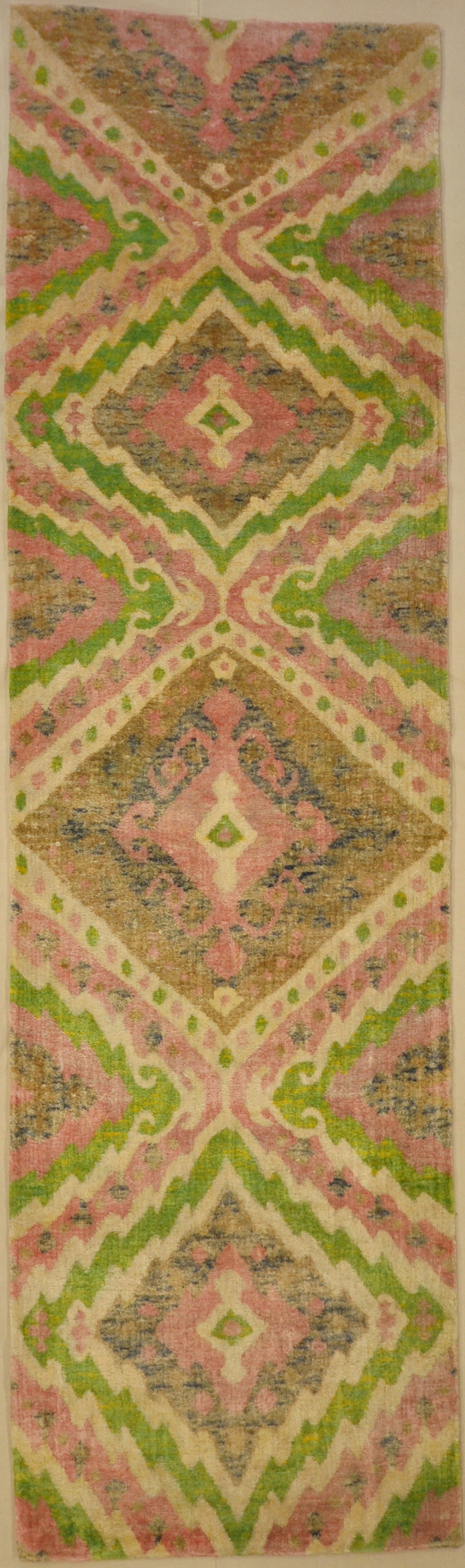 Lovely Patterned Green and Pink Runner. A piece of genuine woven authentic carpet art sold by Santa Barbara Design Center, Rugs and More.