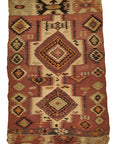 kilims feature muted colors and thin textures to allow the picture itself to stand out as the most noticeable feature on the rug’s surface. Warm colors are often used as the primary hues throughout, though many kilims tend to balance the landscape by also applying cooler tones, which help create points of contrast that entice the viewer’s responsiveness. 2'8 x 4'2