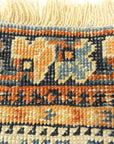 Antique Khamseh with Tribal Flowers. A piece of genuine woven carpet art sold at the Santa Barbara Design Center Rugs and More in Santa Barbara California.
