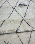 Close-up of the Santa Barbara Chic Moroccan rug, showing its soft texture and geometric diamond patterns.