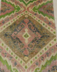 Lovely Patterned Green and Pink Runner. A piece of genuine woven authentic carpet art sold by Santa Barbara Design Center, Rugs and More.