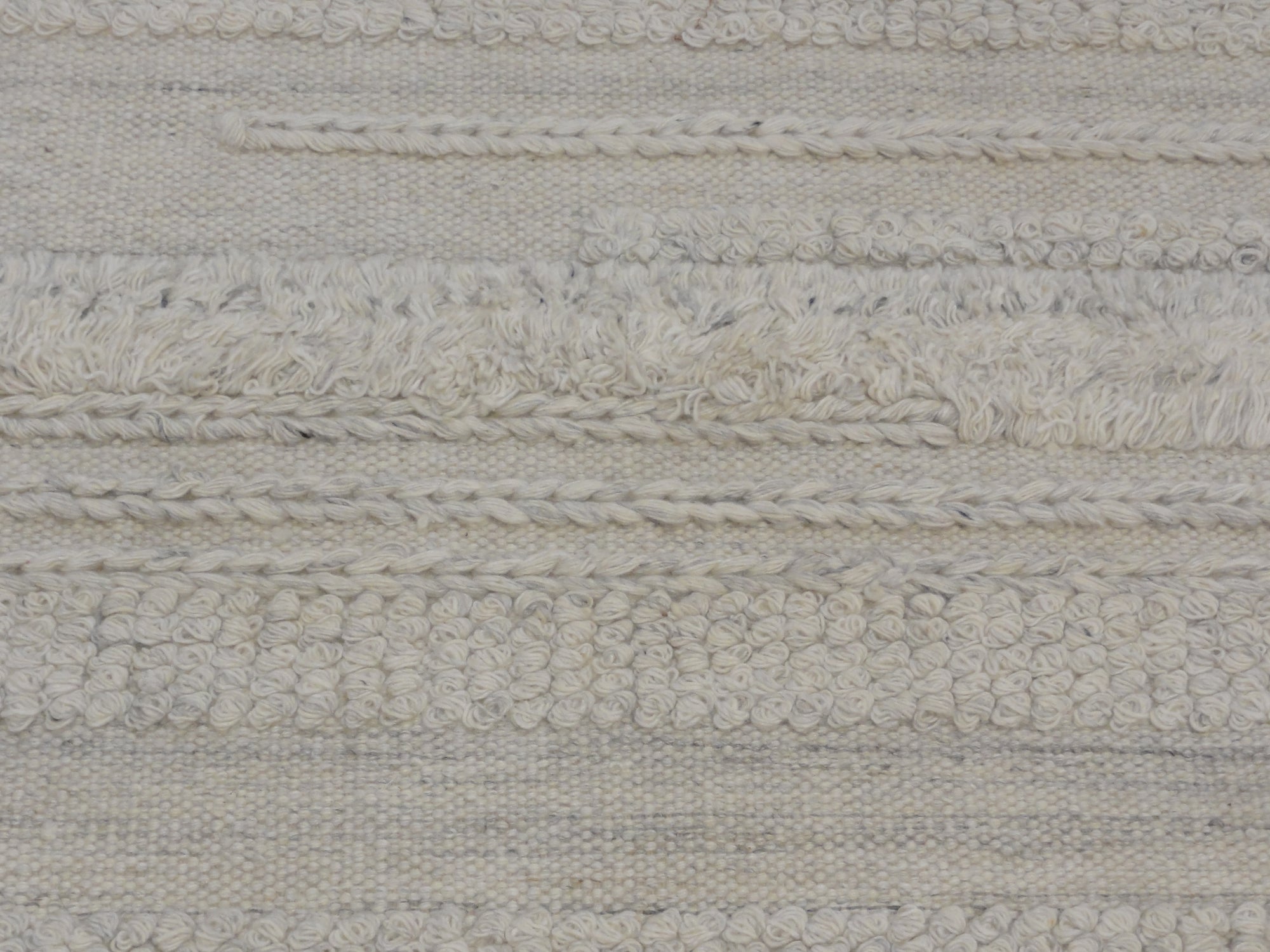 Close-up view of Ziegler &#038; Co Montecito Vibe rug showcasing a textured, woven pattern in neutral tones.