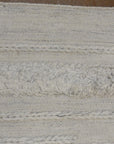 Close-up view of Ziegler &amp; Co Montecito Vibe rug, showcasing its texture and intricate woven patterns in neutral tones.