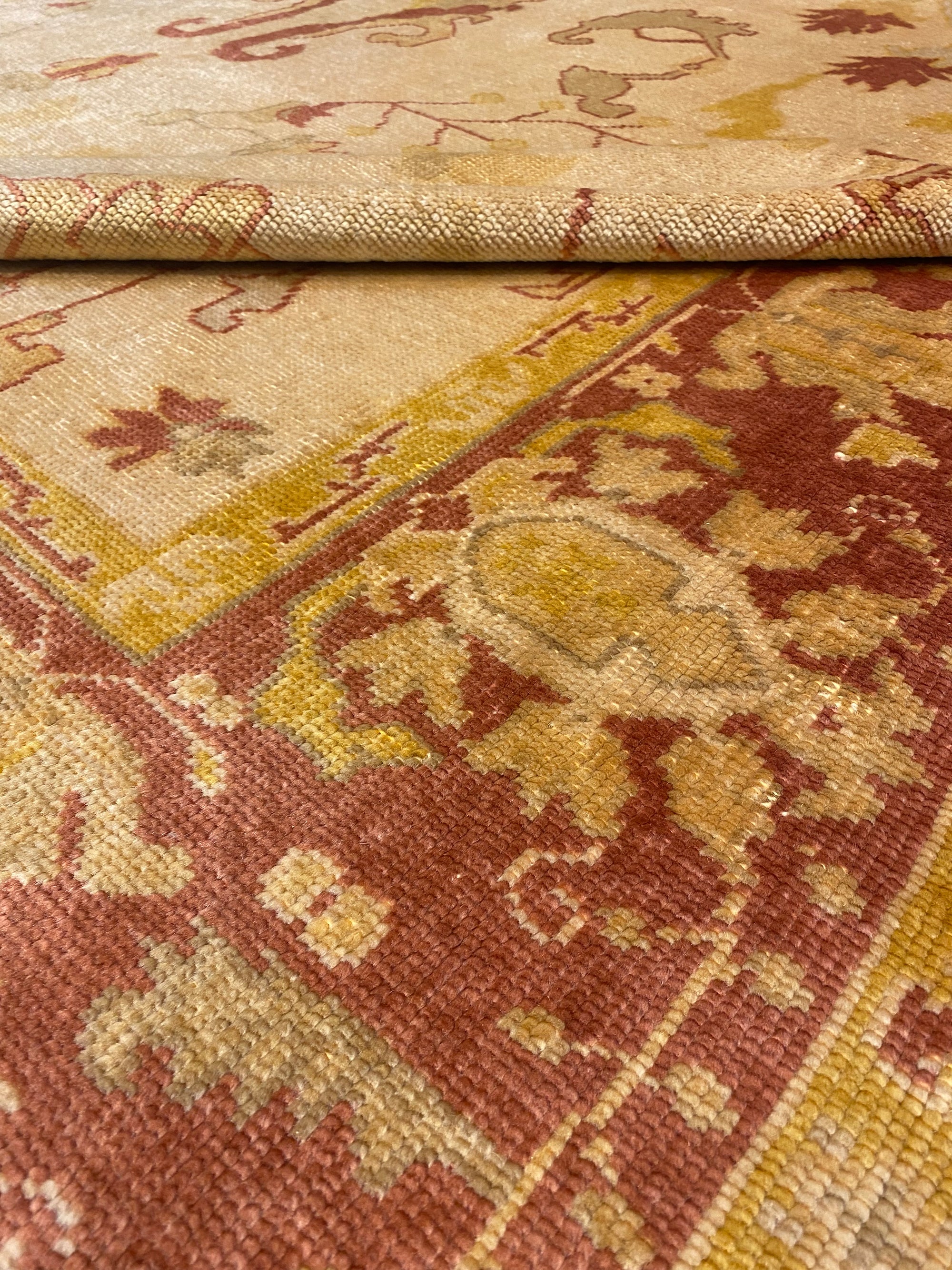 Close-up of Vintage Angora Oushak rug showcasing intricate floral patterns in muted earthy tones.