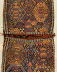 Small Bakhetiari Kelim Saddle Bag some metal threading throughout. Visit us Rugs & More in the Santa Barbara Design Center.
