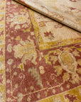 Close-up of a Vintage Angora Oushak rug showcasing intricate floral patterns in warm earthy tones with detailed border design.