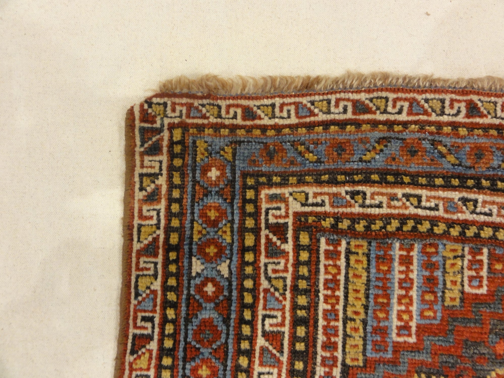 Antique Persian Khamseh Chicken Rug. A piece of genuine woven carpet art sold by Santa Barbara Design Center Rugs and More.